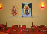 Oxana-Galerie.de Zwei Bilder Buddah und Maria an Wand